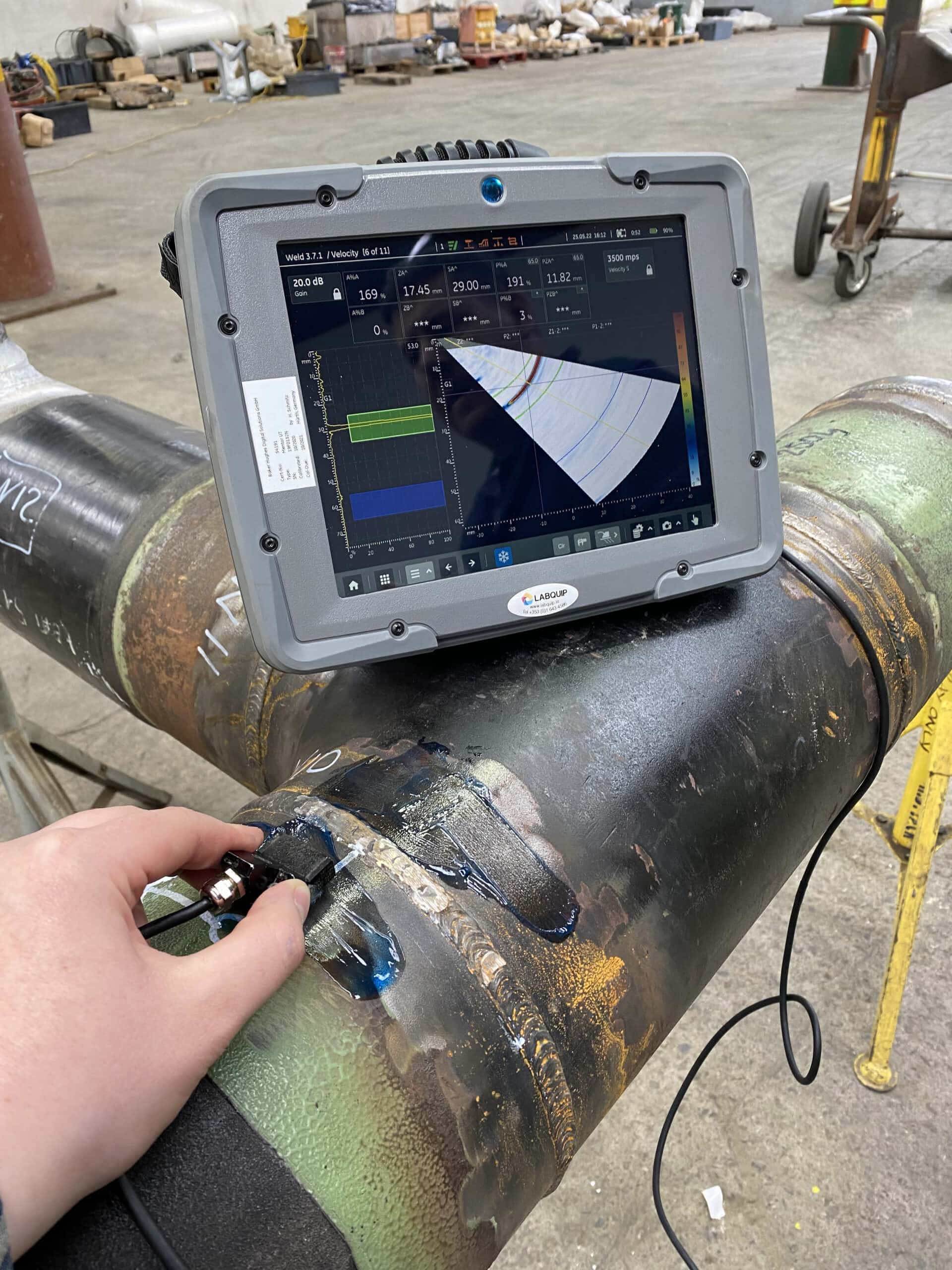 Mentor UT Phased Array Flaw Detector on pipe with custom screen scaled